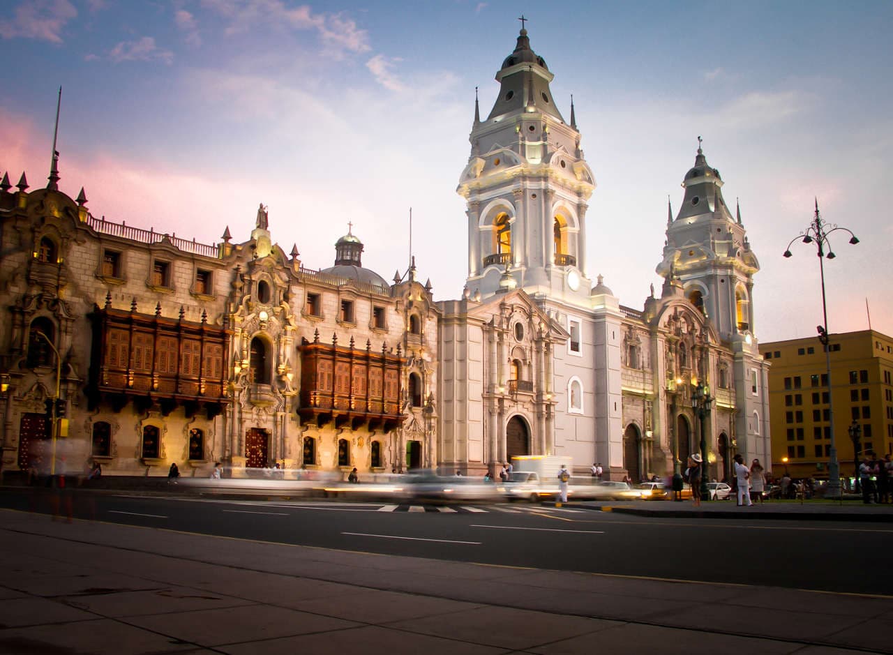 Lima Cathedral and carved wooden balconies on the main square at dusk
