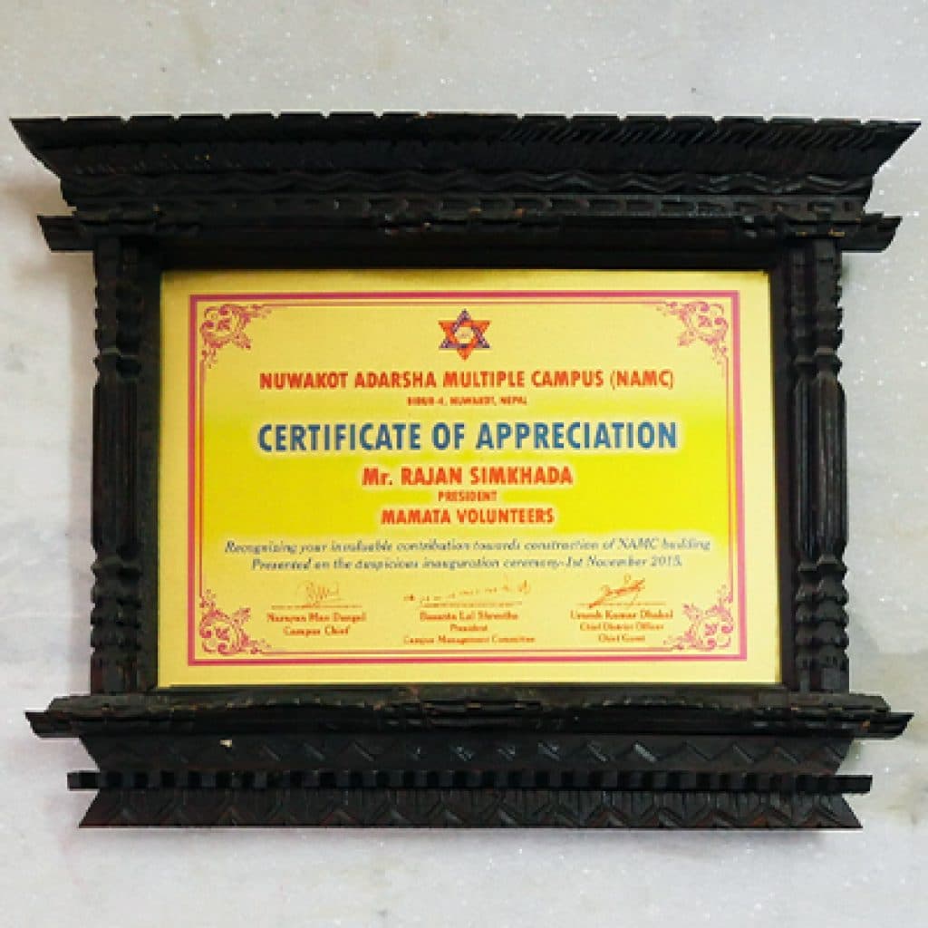 Certificate of appreciation from Nuwakot Adarsha Multiple Campus in a carved wooden frame
