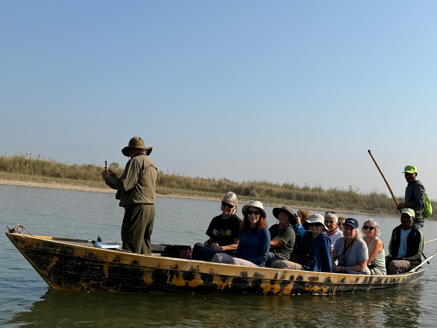 Our travellers in a dugout canoe on the Rapti River in Chitwan